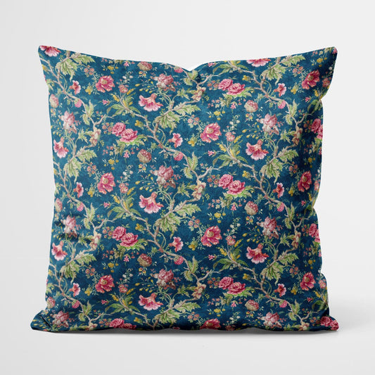 Pillow with small burgundy flowers on blue